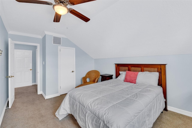 bedroom featuring crown molding, ceiling fan, lofted ceiling, and light colored carpet