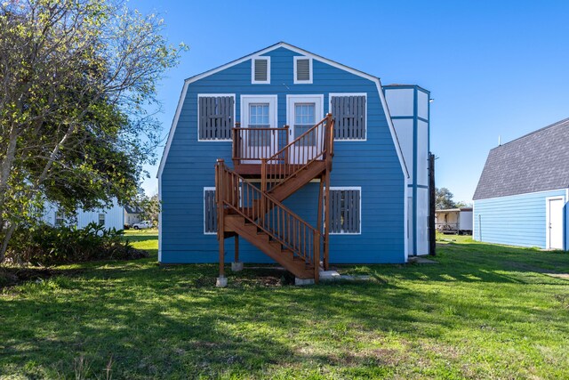 rear view of house with a yard