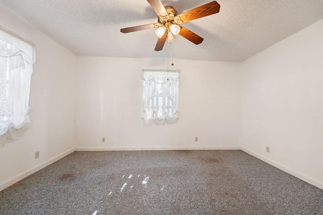 unfurnished room featuring ceiling fan, a textured ceiling, and carpet flooring