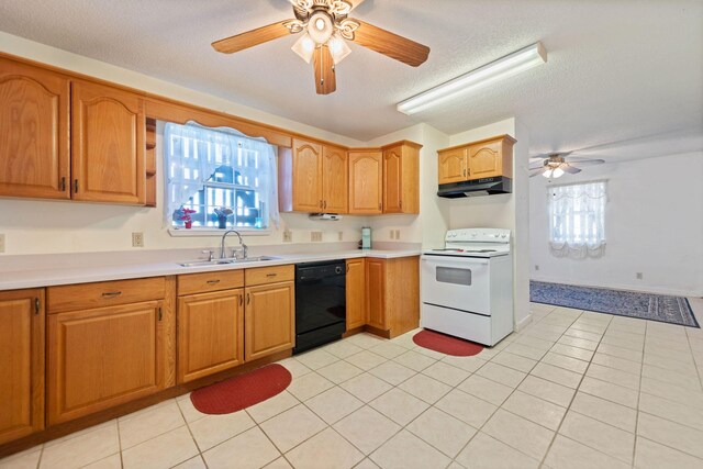 kitchen featuring a textured ceiling, dishwasher, electric stove, sink, and light tile patterned floors