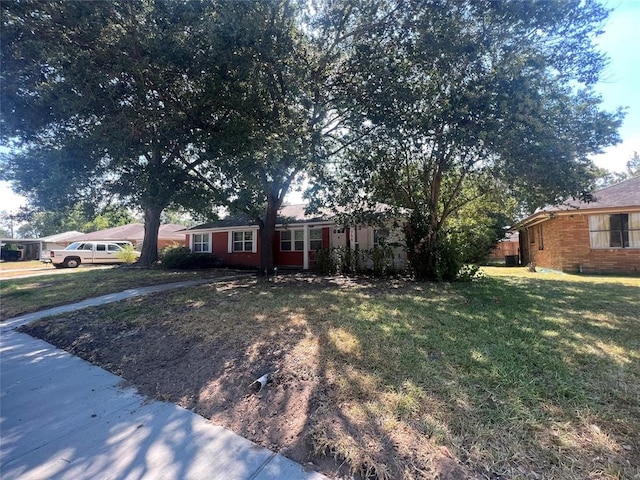 ranch-style house with a front yard