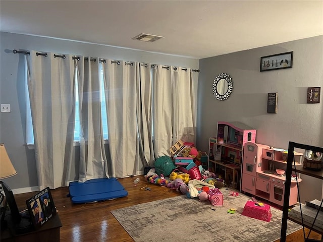 playroom featuring wood-type flooring