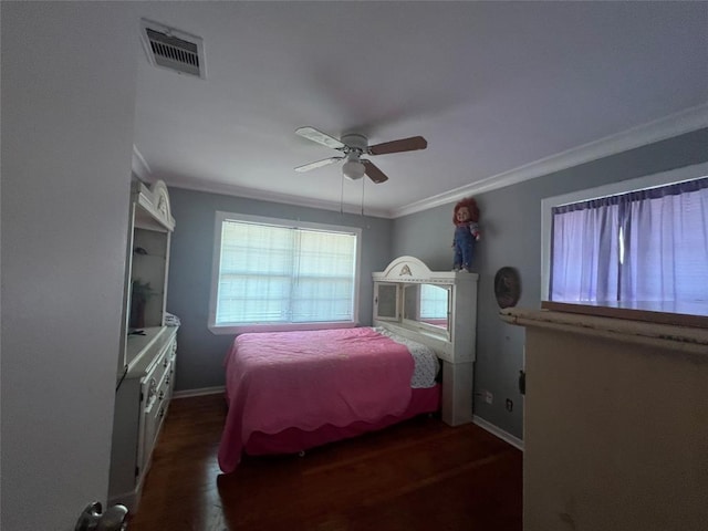 bedroom with crown molding, dark wood-type flooring, and ceiling fan