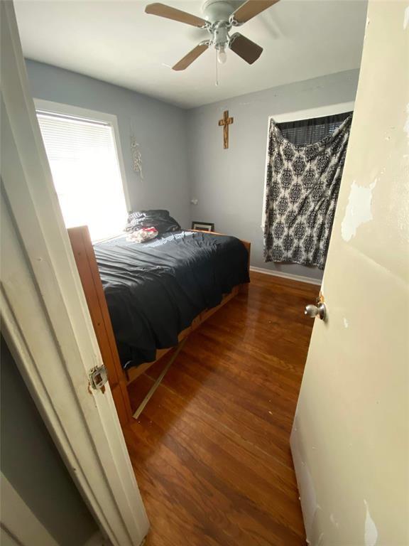 bedroom featuring ceiling fan and wood-type flooring