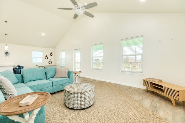 living room with high vaulted ceiling, wood-type flooring, and ceiling fan