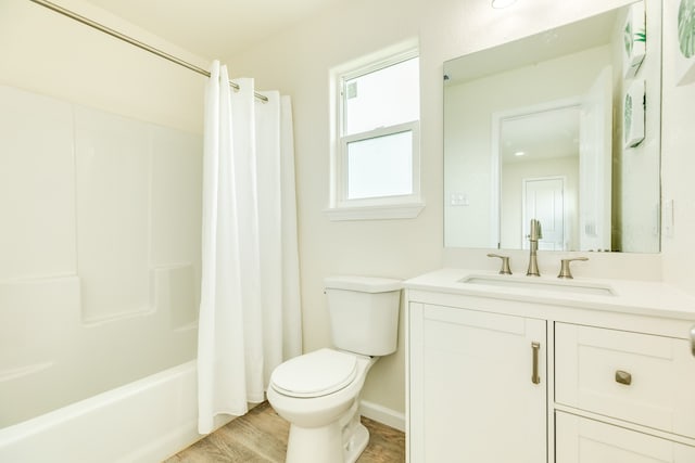 full bathroom featuring wood-type flooring, vanity, toilet, and shower / tub combo with curtain