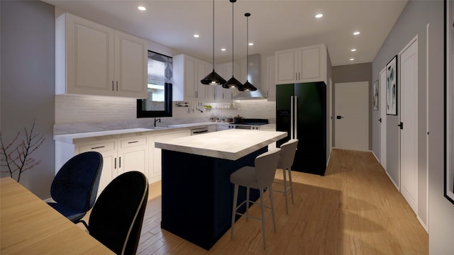 kitchen with pendant lighting, white cabinets, black appliances, and a kitchen island