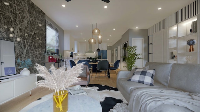 living room with ceiling fan and light hardwood / wood-style flooring