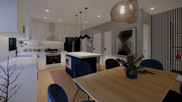 dining space featuring light hardwood / wood-style flooring and sink