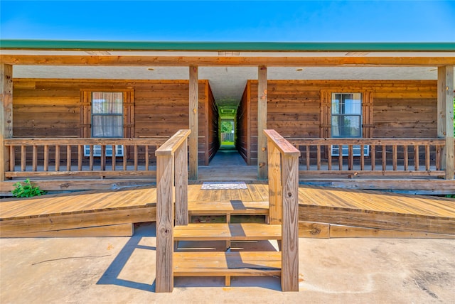 property entrance with covered porch