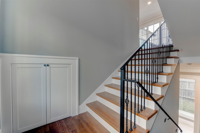 stairs featuring wood-type flooring