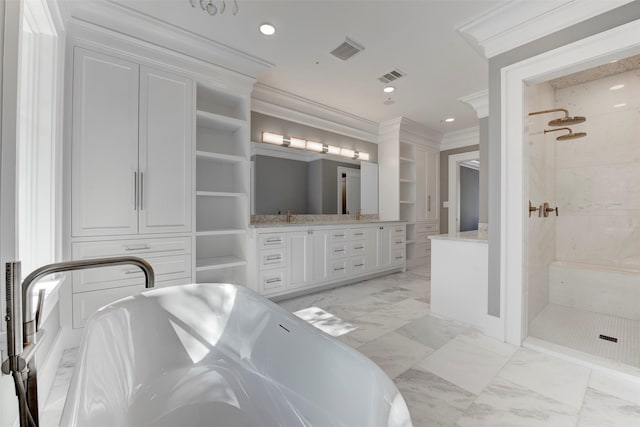 bathroom with vanity, built in features, ornamental molding, and shower with separate bathtub