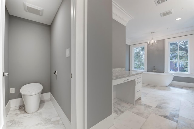 bathroom featuring ornamental molding, a tub, and a chandelier