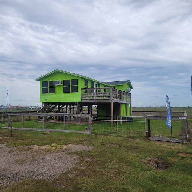 exterior space with a rural view and a front lawn