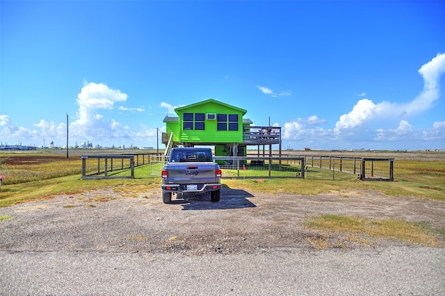 view of parking with a rural view