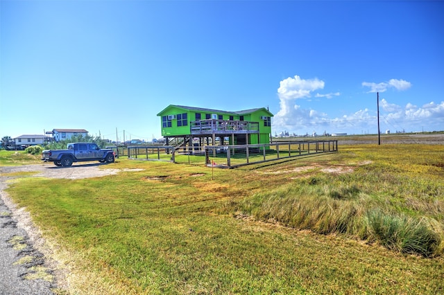 view of jungle gym with a yard and a rural view