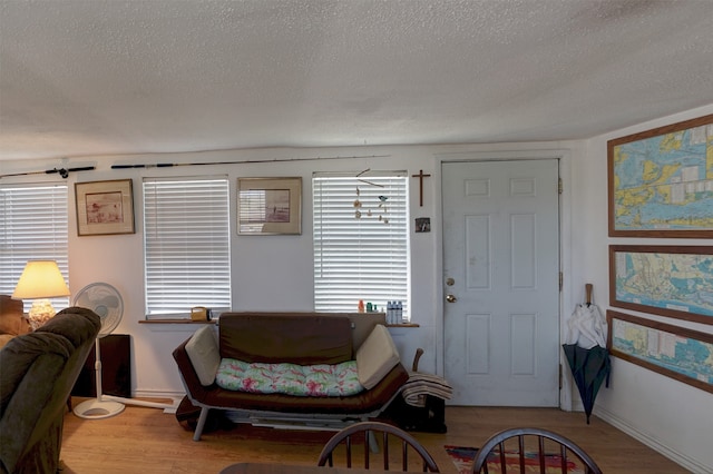 entryway featuring light hardwood / wood-style flooring and a textured ceiling