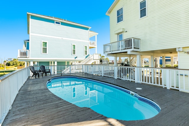 view of pool with a wooden deck