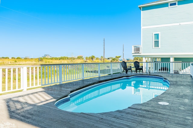 view of pool featuring a wooden deck