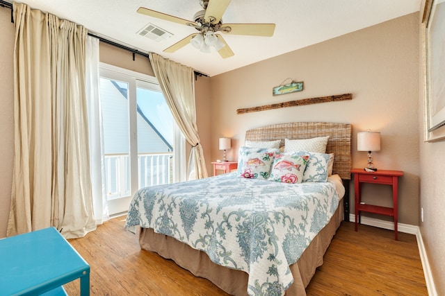 bedroom with light wood-type flooring, access to outside, and ceiling fan