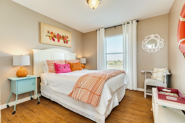 bedroom featuring hardwood / wood-style floors