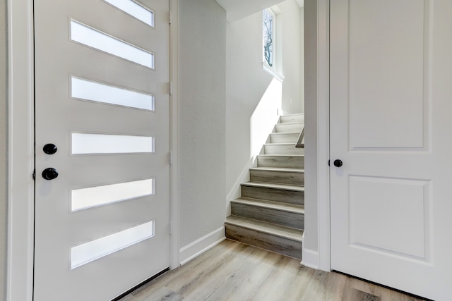 foyer entrance with light hardwood / wood-style floors