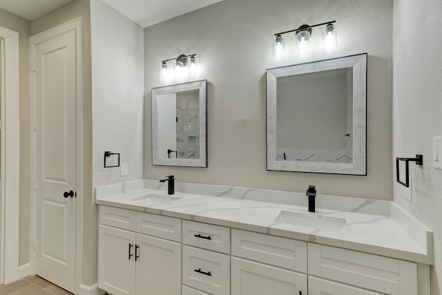 bathroom featuring tile patterned floors and vanity