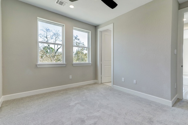 unfurnished bedroom with light carpet and ceiling fan