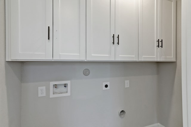 clothes washing area featuring hookup for an electric dryer, hookup for a gas dryer, cabinets, and hookup for a washing machine