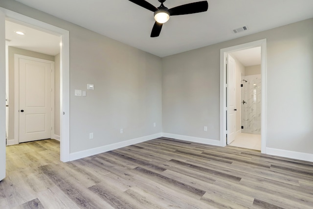 unfurnished room featuring ceiling fan and light wood-type flooring