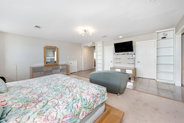 bedroom featuring light carpet