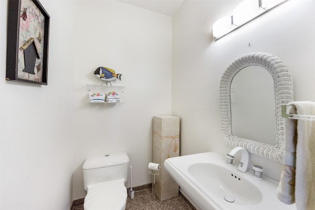 bathroom with sink and toilet