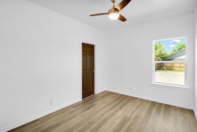 unfurnished room with ceiling fan and light hardwood / wood-style floors