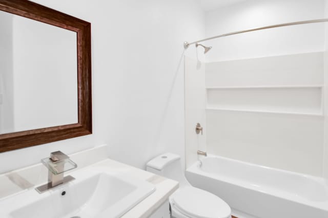 full bathroom featuring bathtub / shower combination, vanity, and toilet