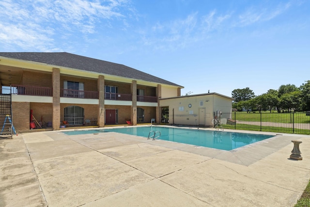 view of swimming pool with a patio