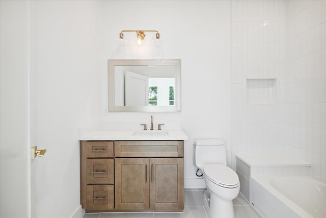 bathroom featuring vanity, a bathtub, tile patterned flooring, and toilet