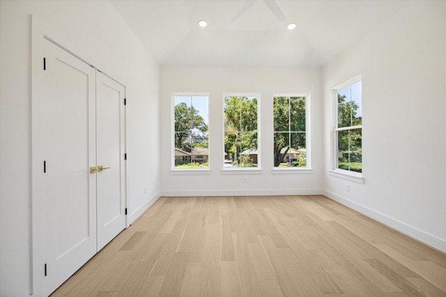 unfurnished sunroom with lofted ceiling