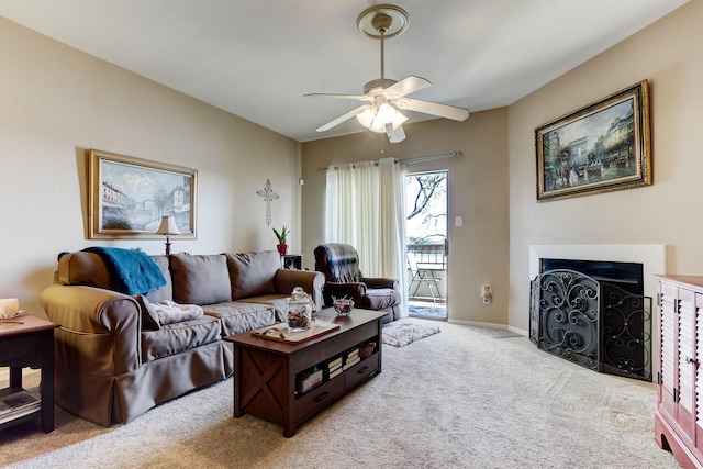 carpeted living room featuring ceiling fan