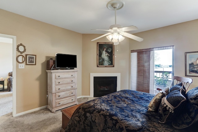 bedroom featuring ceiling fan and light carpet