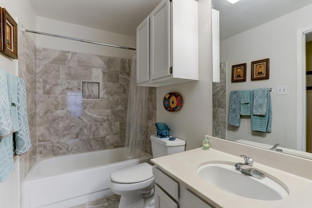 full bathroom with vanity, toilet, and tiled shower / bath combo