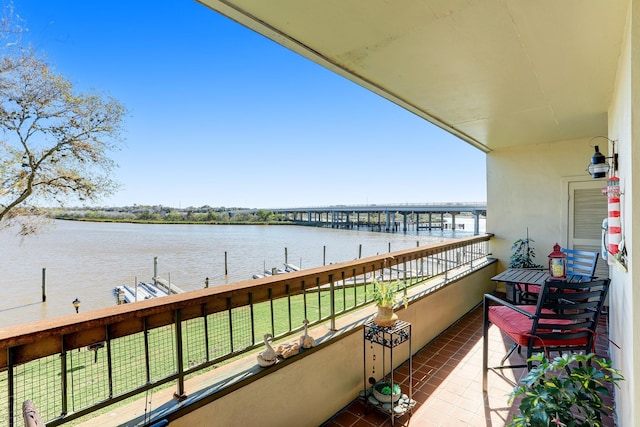 balcony featuring a water view