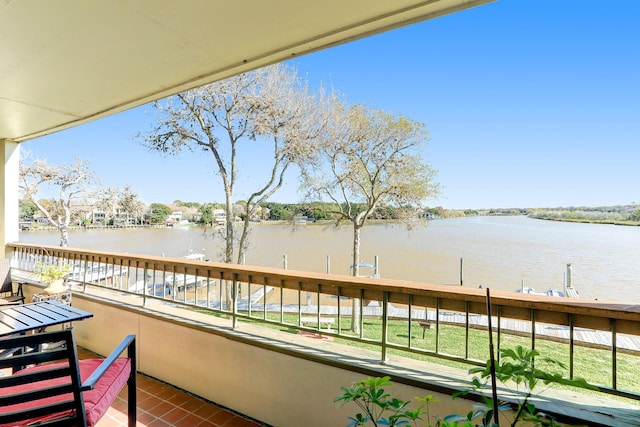 balcony featuring a water view