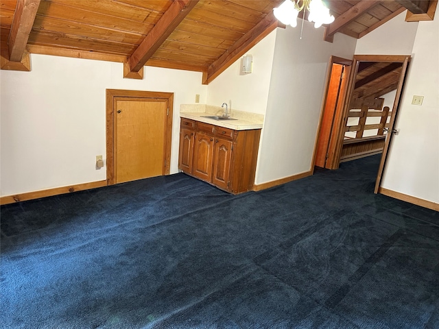 interior space with wood ceiling, sink, and vaulted ceiling with beams