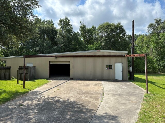 garage with a lawn