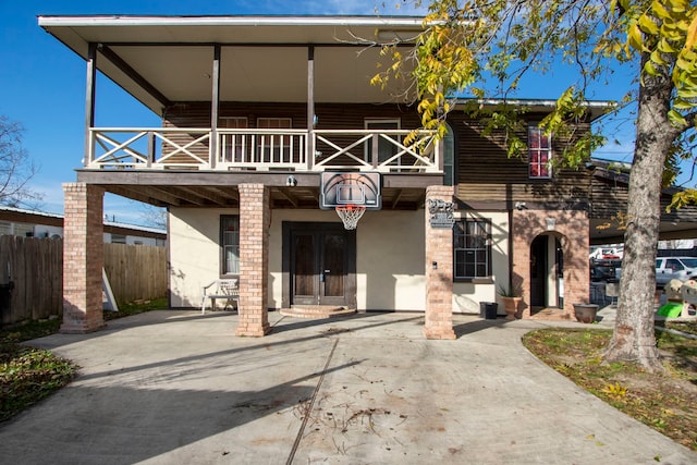 back of property with a balcony