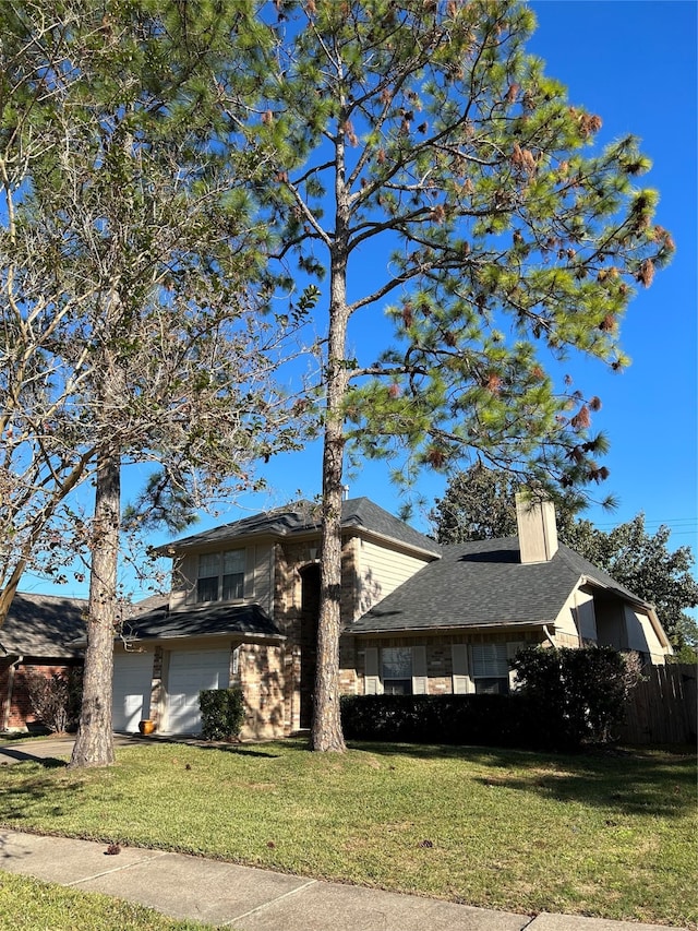 view of side of property with a yard