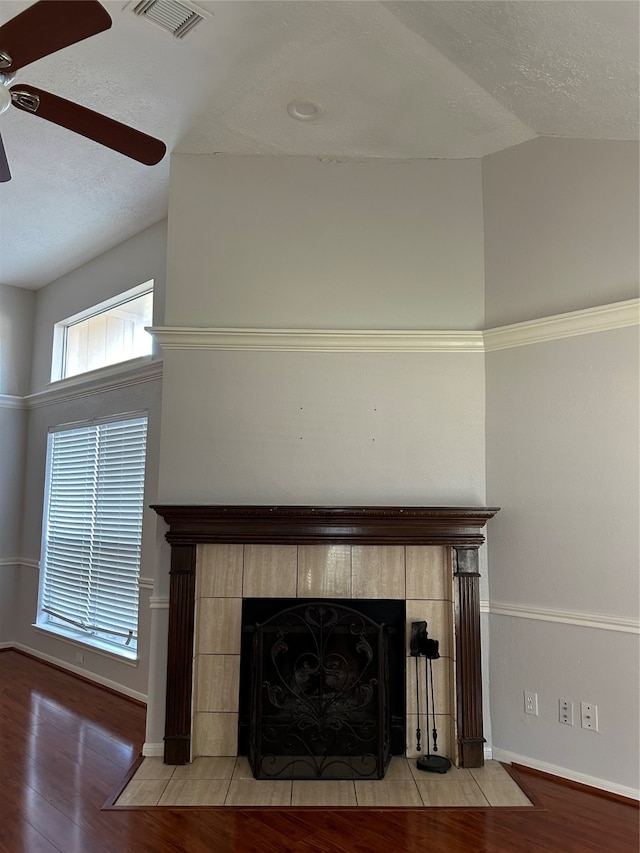 room details featuring hardwood / wood-style flooring, a fireplace, and ceiling fan