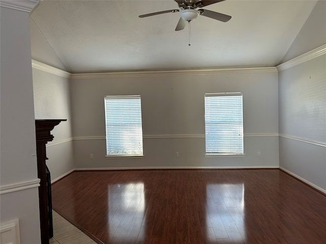 spare room with crown molding, hardwood / wood-style flooring, and lofted ceiling