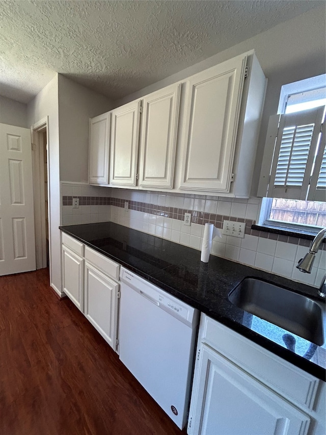 kitchen with white cabinetry, a textured ceiling, dark wood-type flooring, and white dishwasher