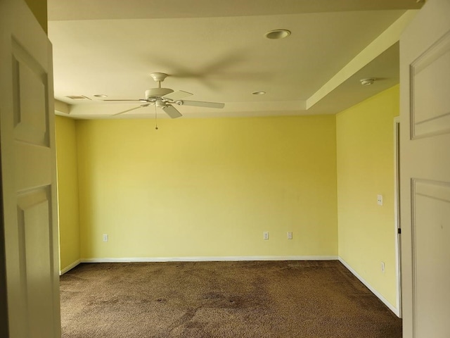 empty room featuring ceiling fan and carpet floors